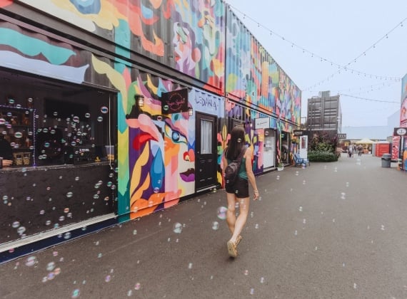 A person walks through the Container Village in Saint John