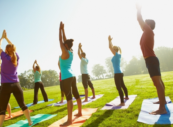 people doing outdoor yoga