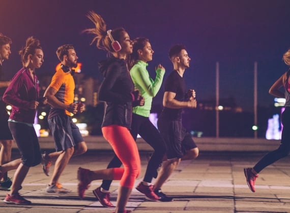 group of runners in the night