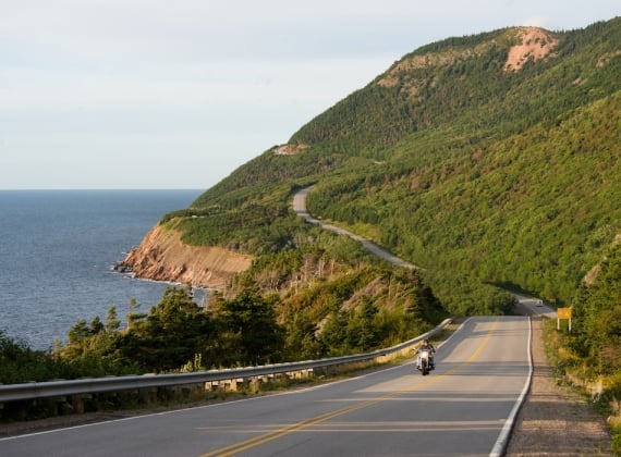 A lone motorcycler rides the Cabot Trail