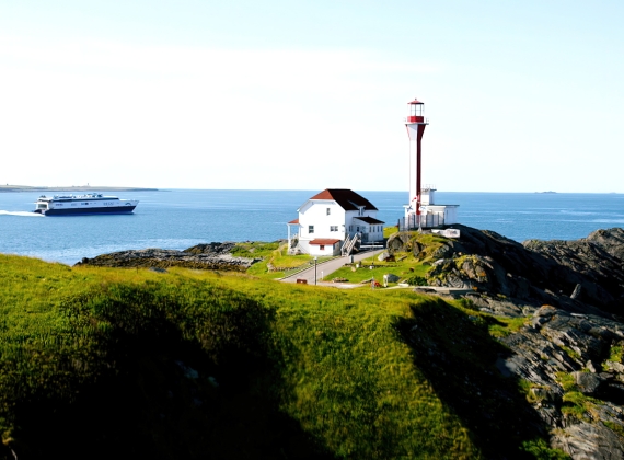 The CAT ferry passing by the Yarmouth lighthouse