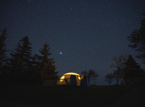 An illuminated observatory at night