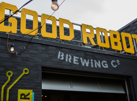 The big, yellow Good Robot Brewing Co. on the front of the business