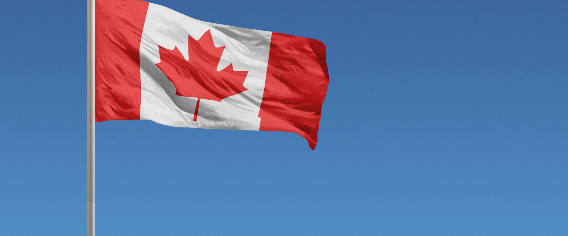 A Canadian flag blowing in the wind